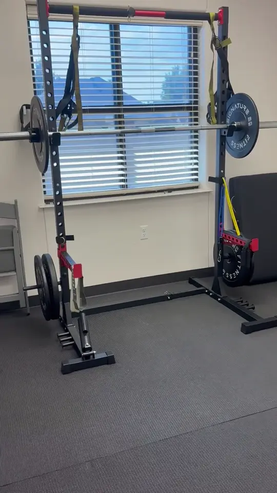 Benches, weights, and strength-training equipment inside the HerMovementSPACE studio in Willow Park.